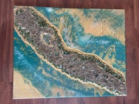 a painting of a blue and gold seascape on a wooden floor